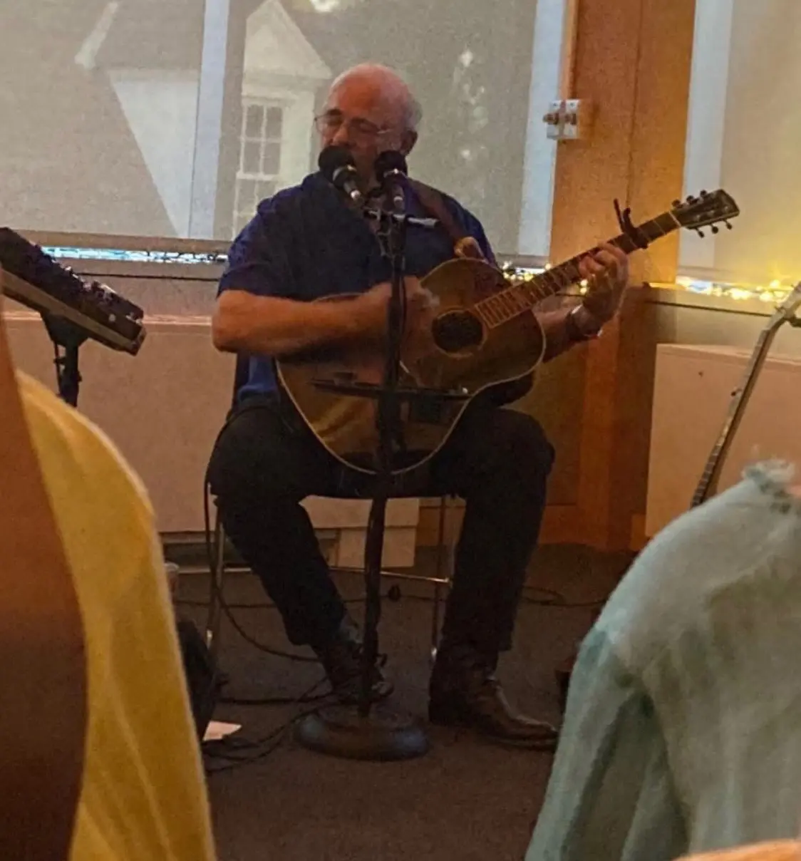 Dave Miller performing seated at indoor venue